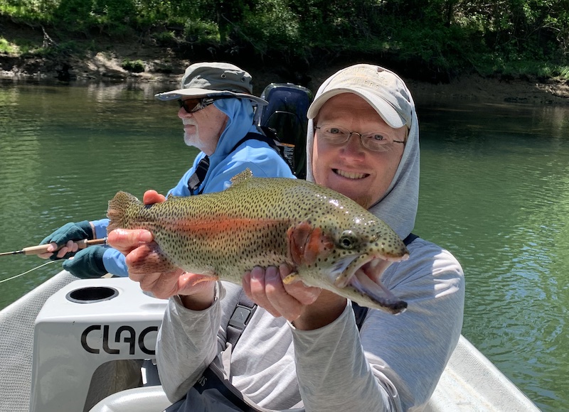 A big rainbow trout with Obey River fly fishing guide David Knapp for a happy client.